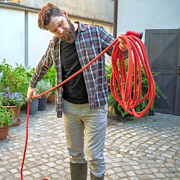 The Smart, Space-Saving IKEA Hack To Store A Garden Hose