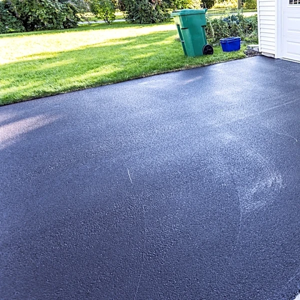 The Affordable Kitchen Staple To Use For Removing Oil Stains From Your Asphalt Driveway