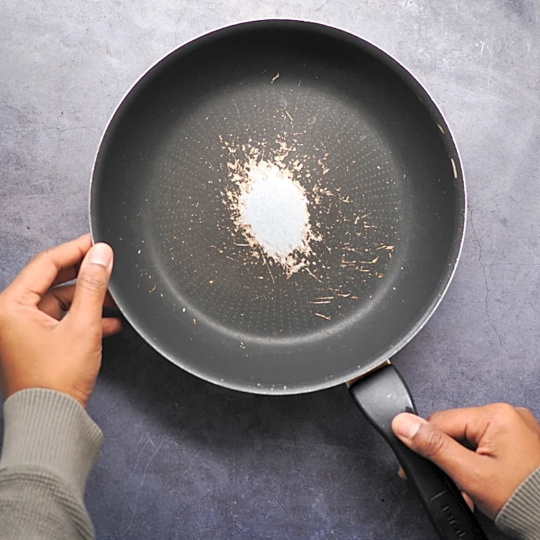 Turn Old Frying Pans Into A Space-Saving Alternative For Bathroom Counter Storage