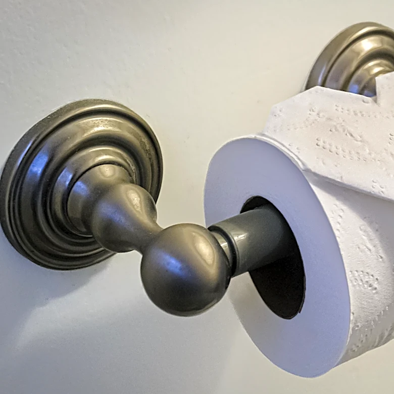 No Toilet Paper Holder? Make One From Old Lids And Wood Dowels