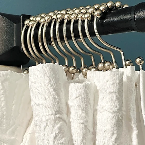 Dump Your Billowy Bathtub Curtain For A Stylish, Space-Saving Alternative From Amazon