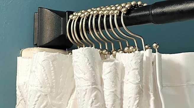 Dump Your Billowy Bathtub Curtain For A Stylish, Space-Saving Alternative From Amazon