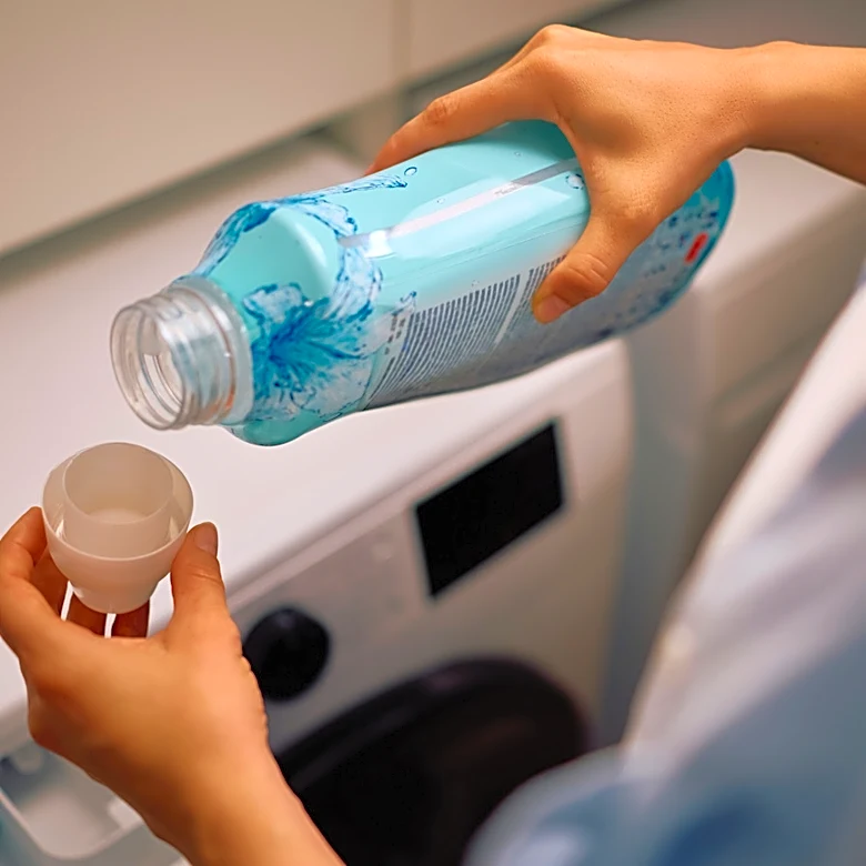Use Fabric Softener Caps To Make A Cute Hanging Floral Display For Your Home