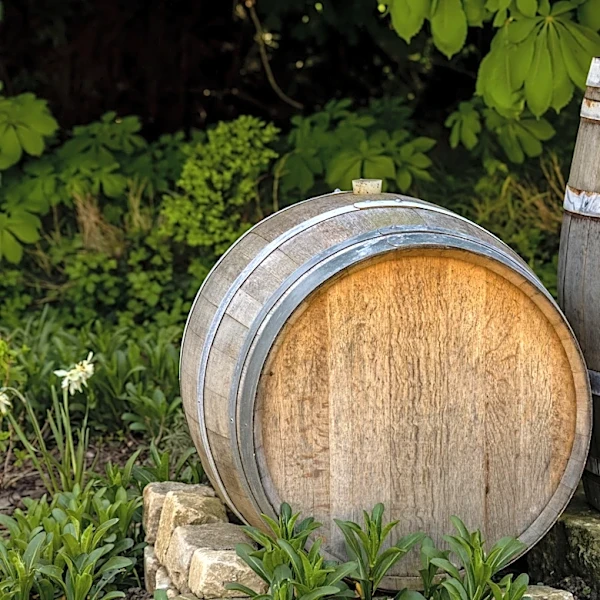 Man Turns An Old Wine Barrel Into A Rustic Garden Bench With An Impressive DIY
