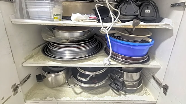 Goodbye Cluttered Cabinets: Store Old Pot Lids With A Wire Hanger Hack
