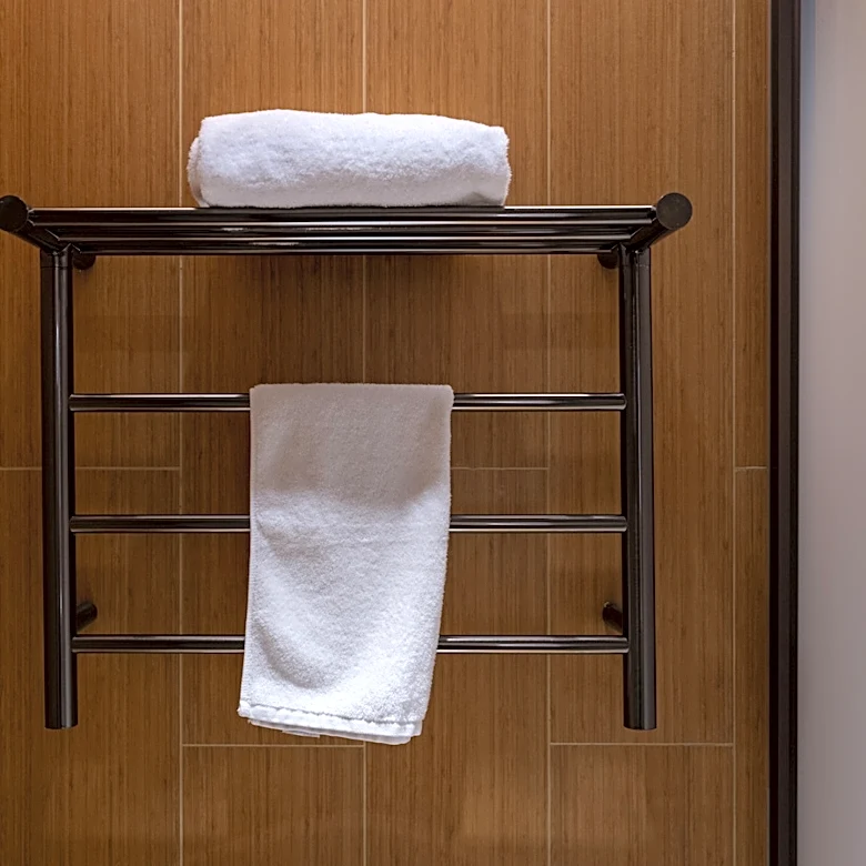 Turn A Towel Rack Into A Clever Way To Hang Vintage Blankets And Tapestries