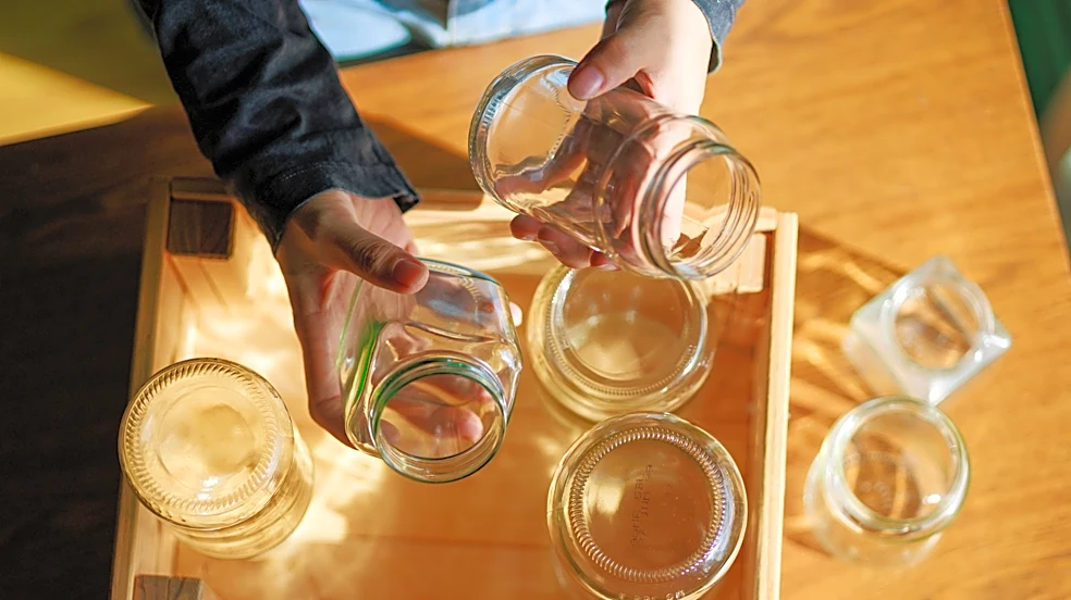 They Transform A Simple Wood Frame Into An Impressive Greenhouse Using Glass Jars