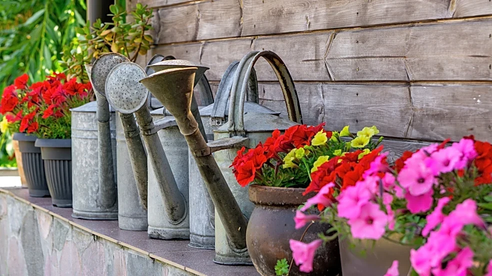 Use Old Watering Cans To DIY A Rain Chain Full Of Charm