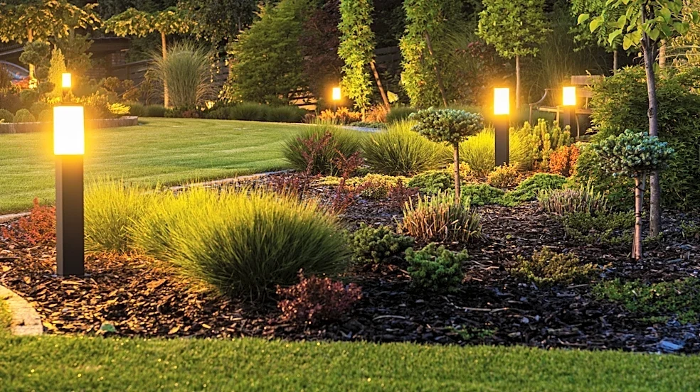Say Goodbye To Pricey Outdoor Lights — Use Old Paint Cans To Brighten Garden Paths