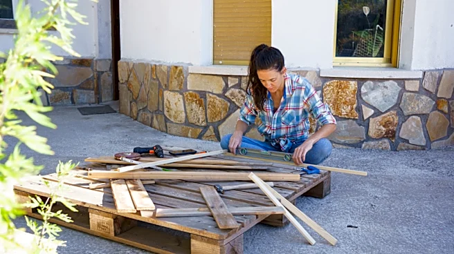 Woman Replaces Concrete Slabs With Old Wood Pallets For A DIY Deck With A Rustic Touch