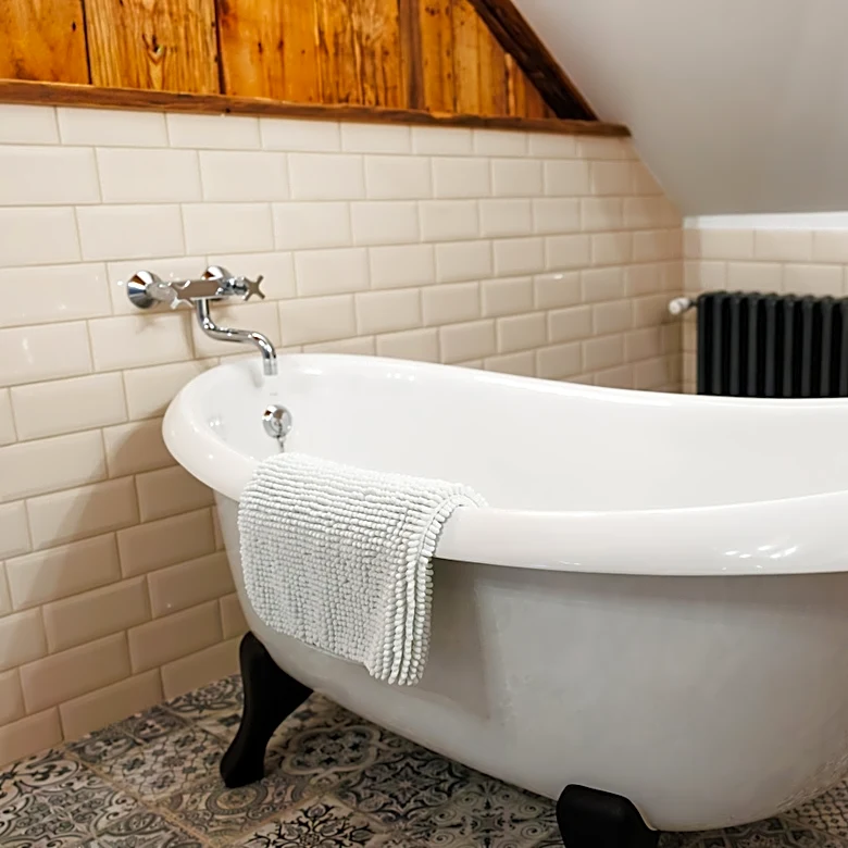 The Custom Solution For Slanted Ceilings You Need For Bathroom Storage