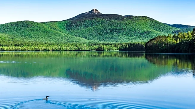 New Hampshire's Postcard-Worthy Lake Is A Swim And Fish Paradise With A Wildly Majestic Mountain Backdrop