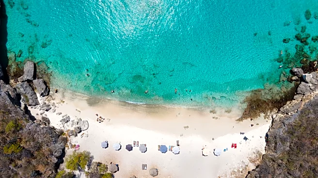 Curacao's Less Touristy Beach Features Bright Turquoise Waters Surrounded By Serene Sandy Cliffs