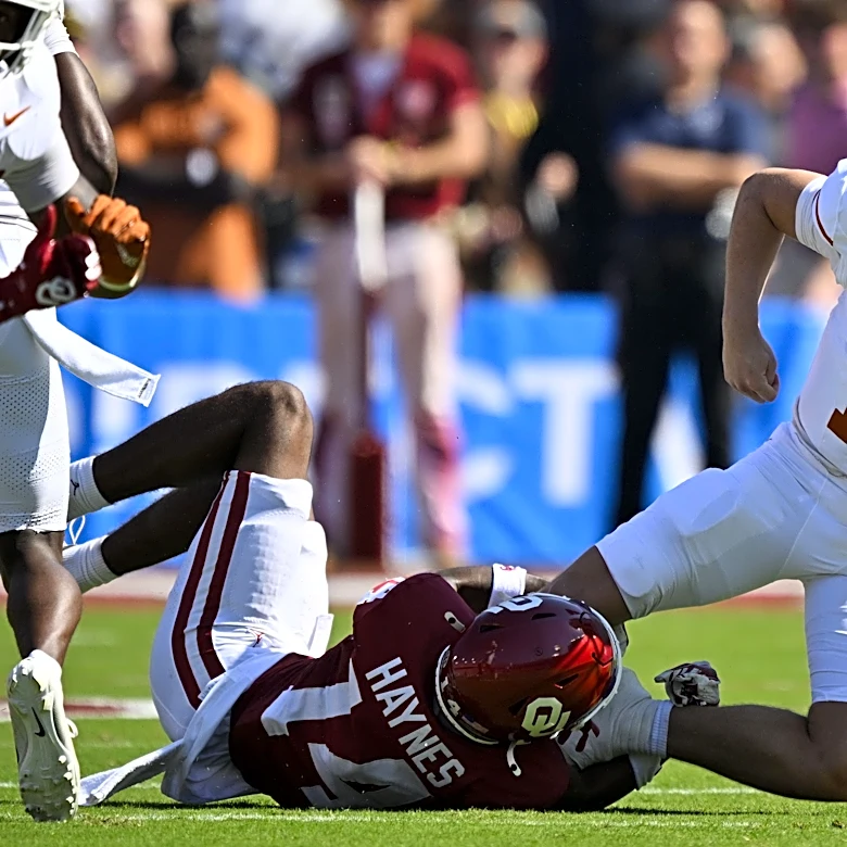 How far did Texas Longhorns fall in US LBM Coaches Poll after OU Loss?
