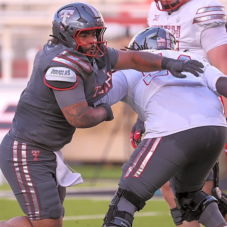 Which defensive tackles will join A.J. Holmes up front for Texas Tech football?