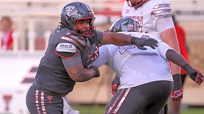 Which defensive tackles will join A.J. Holmes up front for Texas Tech football?
