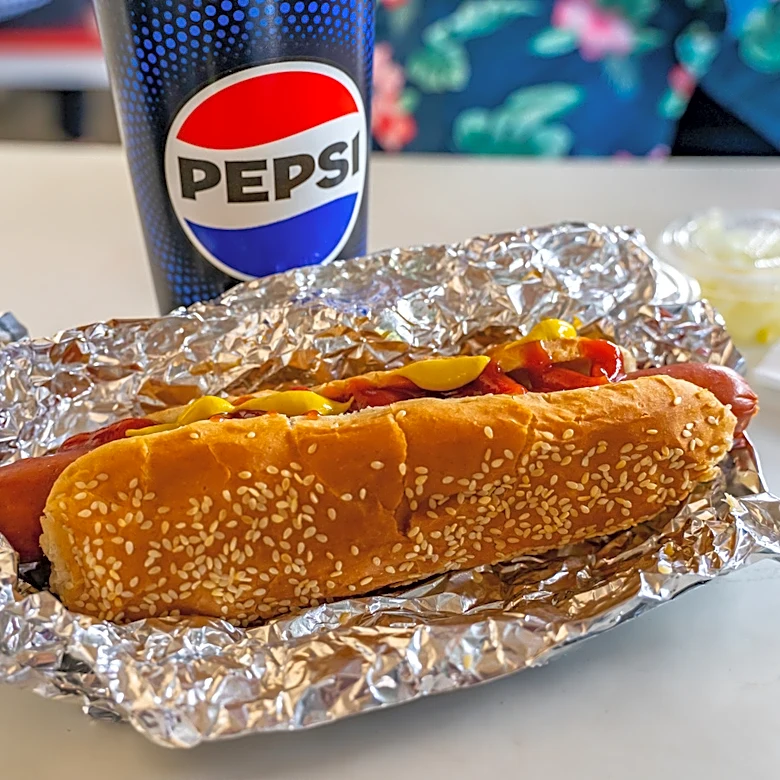 This Ingredient Gives Costco Hot Dogs A Hint Of Sweetness