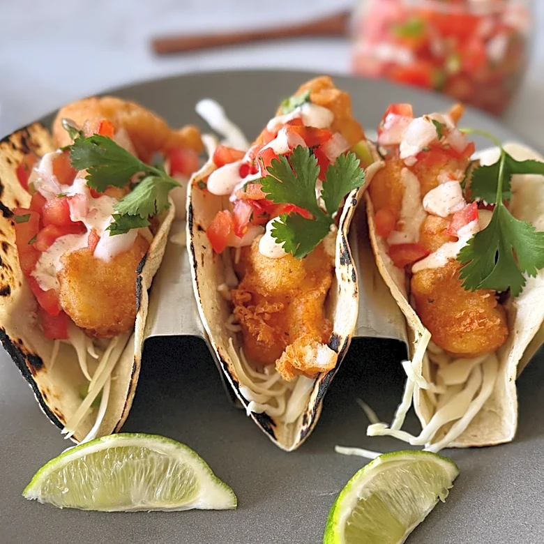 Baja-Style Fish Tacos With Crunchy Slaw And Tangy Lime Crema