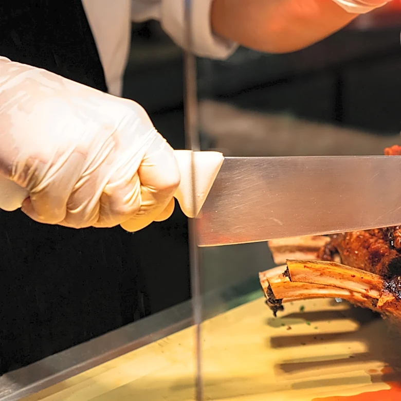 The Trick A Steakhouse Uses To Keep Prime Rib Perfectly Seasoned