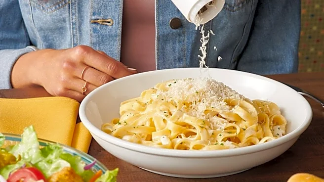 That Freshly Grated Cheese At Olive Garden Isn't What Many Diners Think