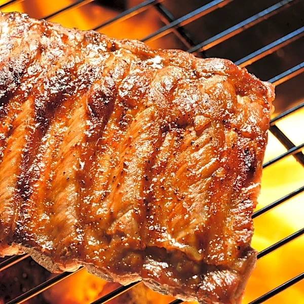 Pork Ribs Came Out Tough? This Butter And Apple Juice Trick Could Save Your BBQ