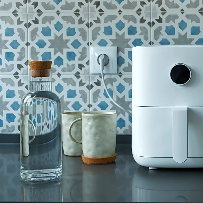Why You Should Add Water To Your Air Fryer When Reheating Food