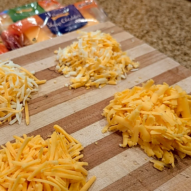 Why Pre-Shredded Supermarket Cheese Never Melts The Way You Expect