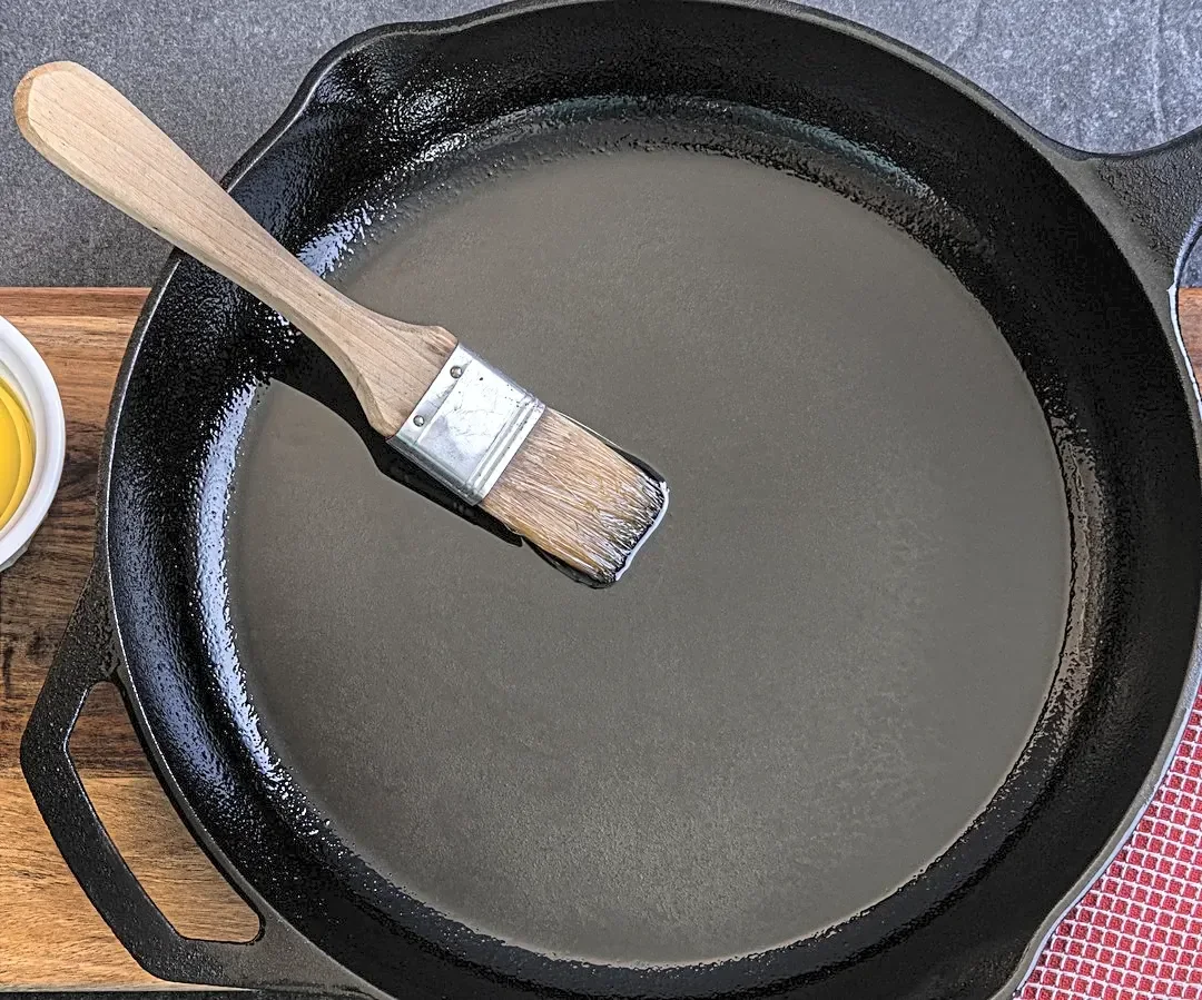 Why Butter Isn't The Right Choice To Season Your Cast Iron Skillet With