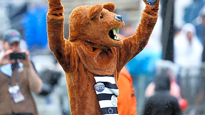 Matt Campbell holds Penn State's first ever Victory Day