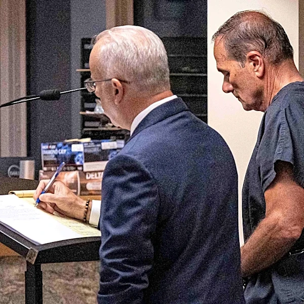 Wife of jailed clerk Mike Caruso says 'I believe in his innocence'