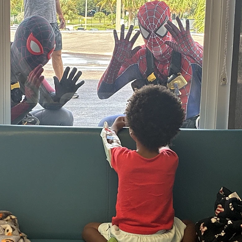 Spider-Man window cleaners surprise young patients at West Palm hospital