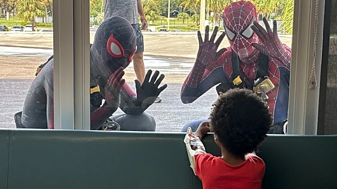 Spider-Man window cleaners surprise young patients at West Palm hospital