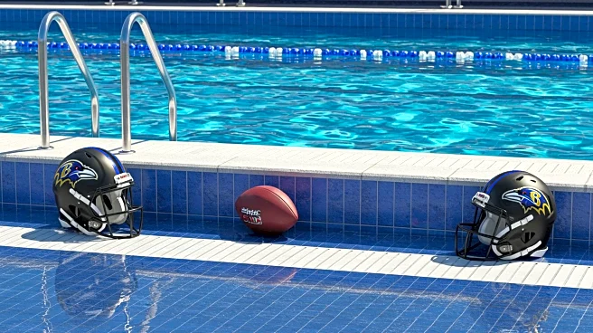Michael Phelps Assists Baltimore Ravens Players in Swimming Lessons