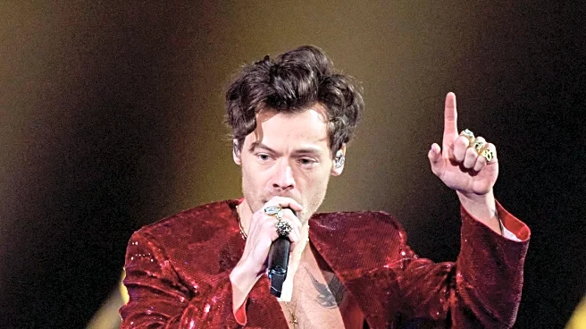 Harry Styles Adopts Britpop Bucket Hat, Influencing Summer Fashion Trends