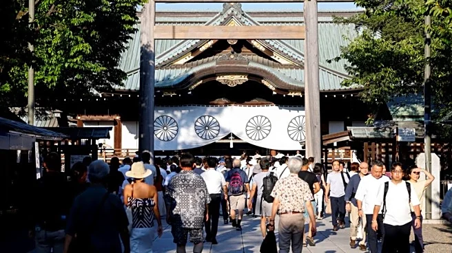 Japan minister joins crowds at controversial shrine to mark 80 years since world war defeat