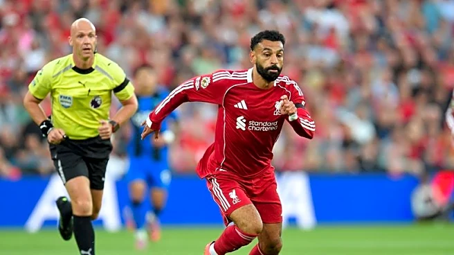 Soccer-Late Salah, Chiesa goals give Liverpool 4-2 win in thrilling opener