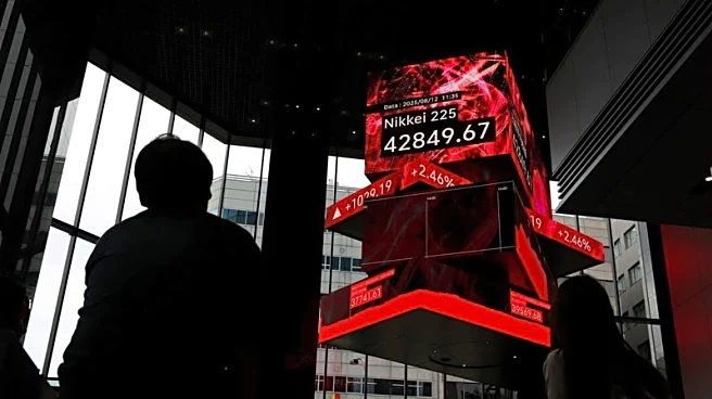 Shares nudge higher in Asia, oil slips on truce talks