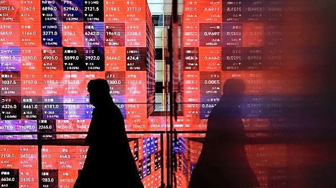 Japan's Nikkei hits record high as automakers rise on weaker yen