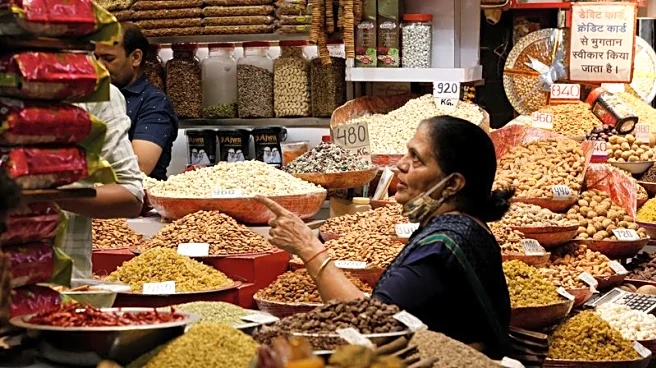India rate panel says US tariffs key drag on growth, flags benign inflation outlook