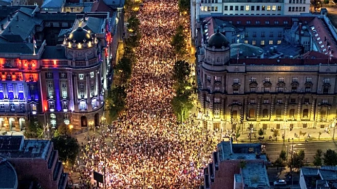 Tens of thousands march in Serbia's capital, demand snap vote