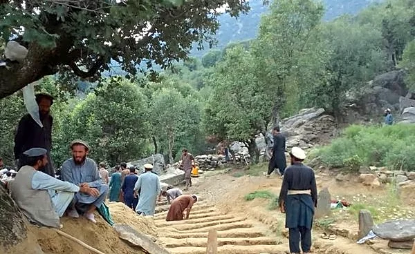 Afghan quake survivors dig graves with pickaxes as entire households wiped out