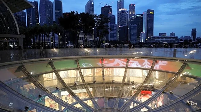 Singapore MAS survey shows economists lift GDP forecast, see steady policy