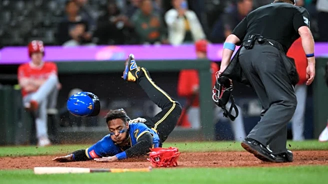 MLB roundup: M's win in 12, grab share of AL West lead
