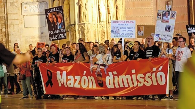 Protesters urge regional Spanish leader to quit a year after deadly floods