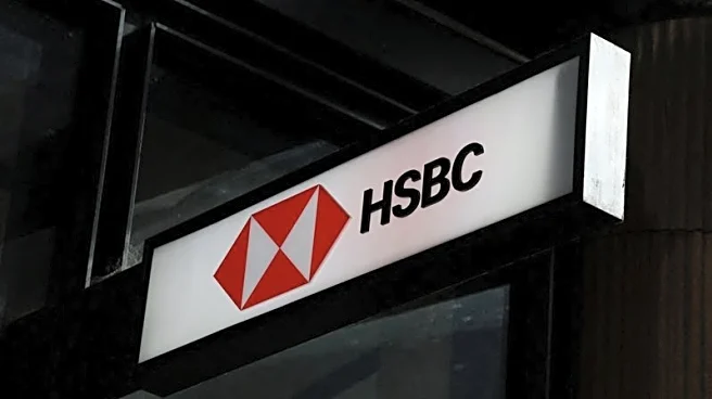 HSBC third-quarter profit slides on Madoff charges, but lifts income outlook