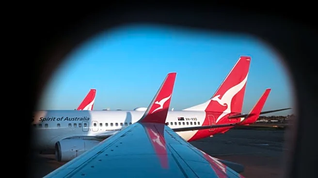 Qantas cuts first-half domestic revenue forecast, citing softer travel demand
