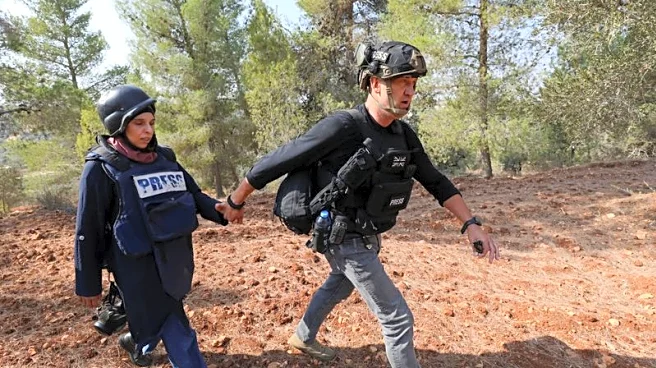 Israeli settlers attack Palestinians, journalists at West Bank olive harvest, witnesses say