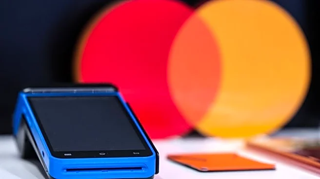 Visa and Mastercard near settlement with merchants, would lower fees, WSJ reports