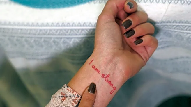 Ukrainians turn to tattoos to ease grief from war