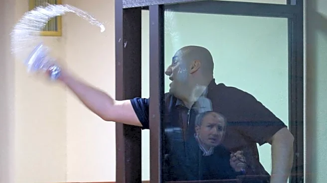 Jailed Georgian opposition politician gets extra sentence for splashing water at judge